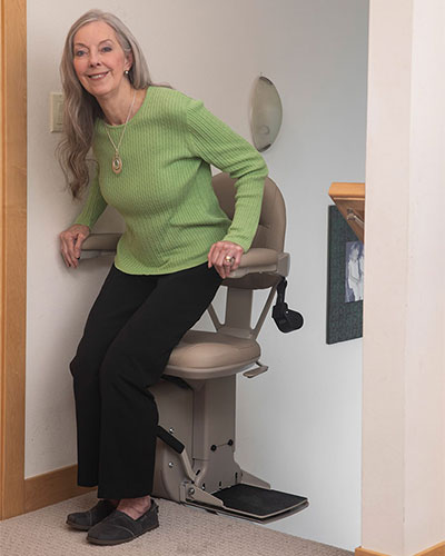 Stairlift user exiting a Bruno stairlift using offset swivel | StairliftResearch.com™